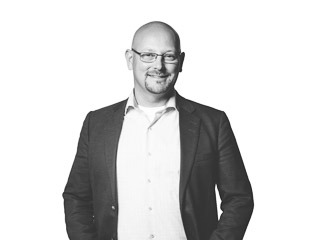 Porträttbild av Henrik Belin, affärsutvecklare på Archus